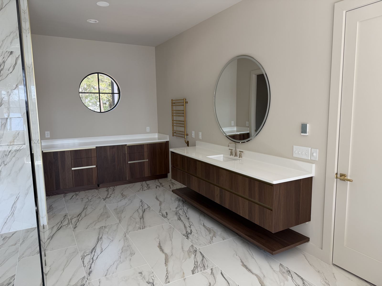 Custom bath vanity with stone top and integrated storage