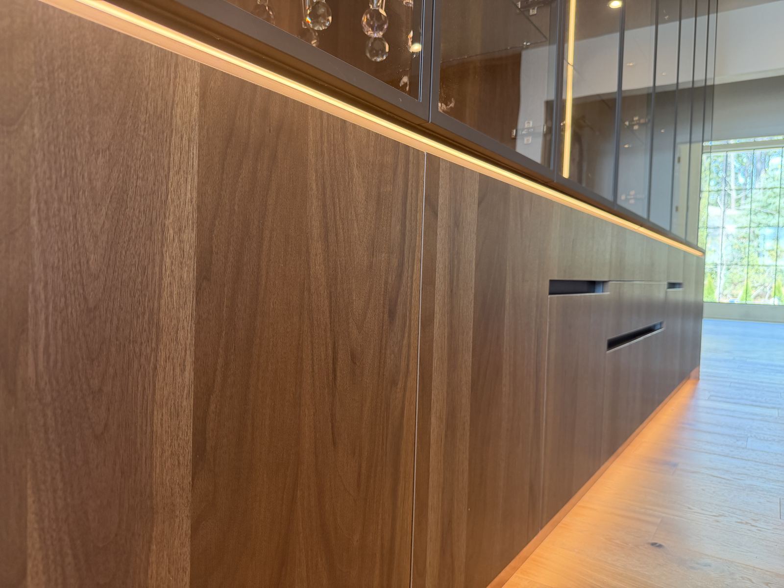 Walnut architectural wall paneling in a finished interior