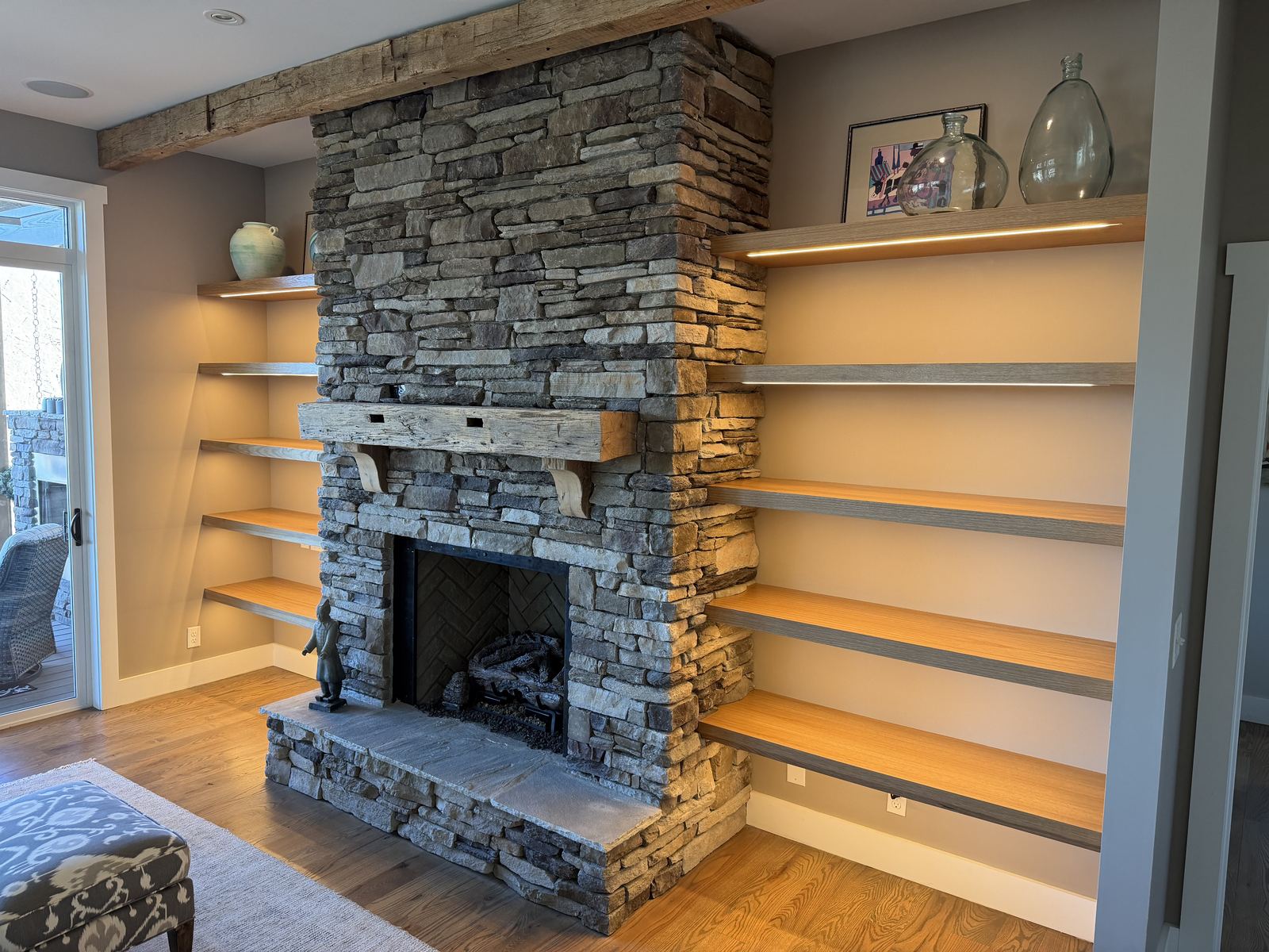 Stone Fireplace with Flanking Built-Ins