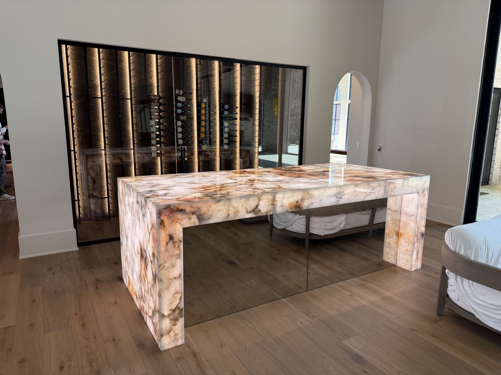 Fluted custom kitchen island with stone countertop in a finished interior