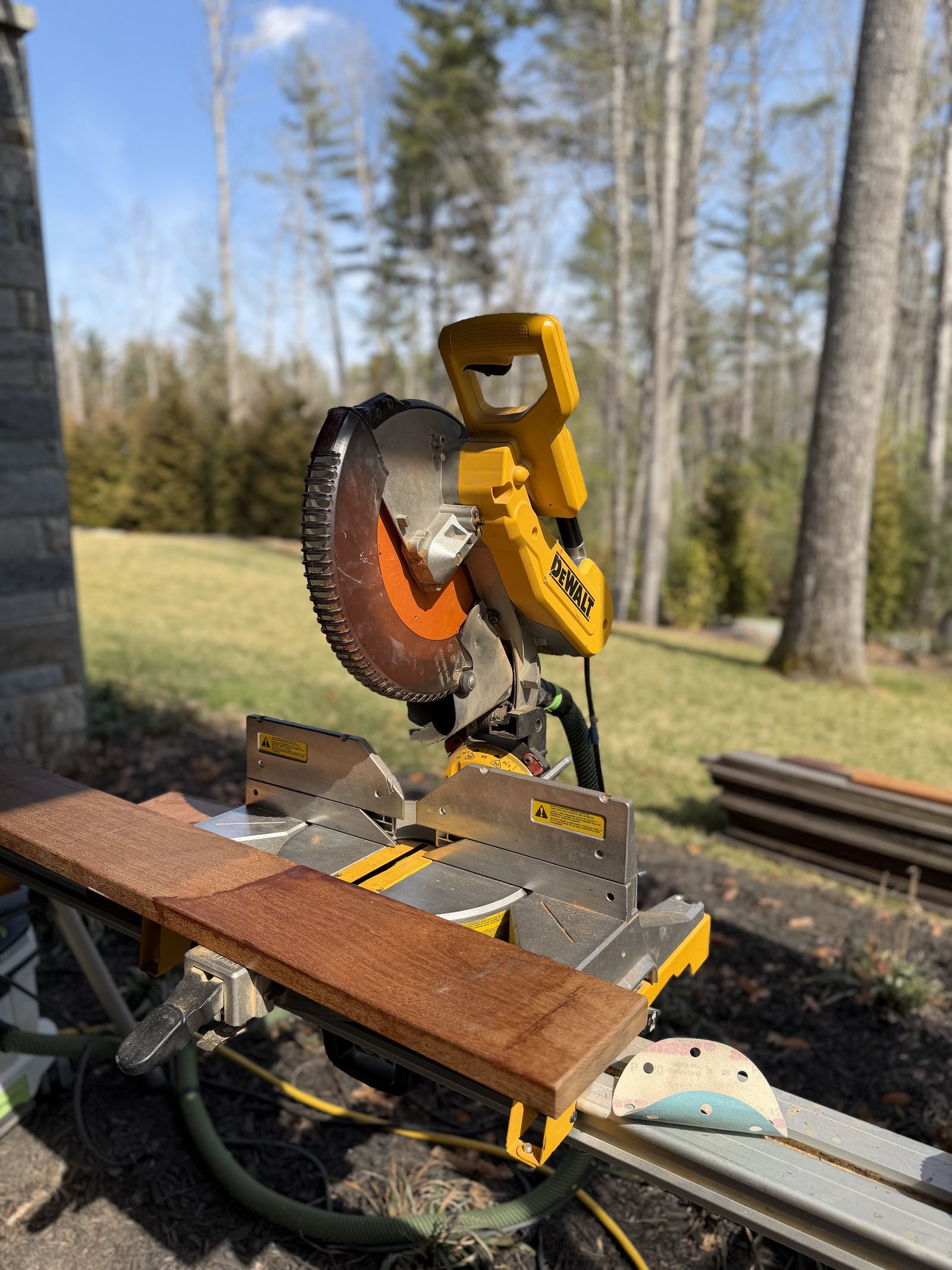 Blue Ridge Carpenters team member cutting timber on site